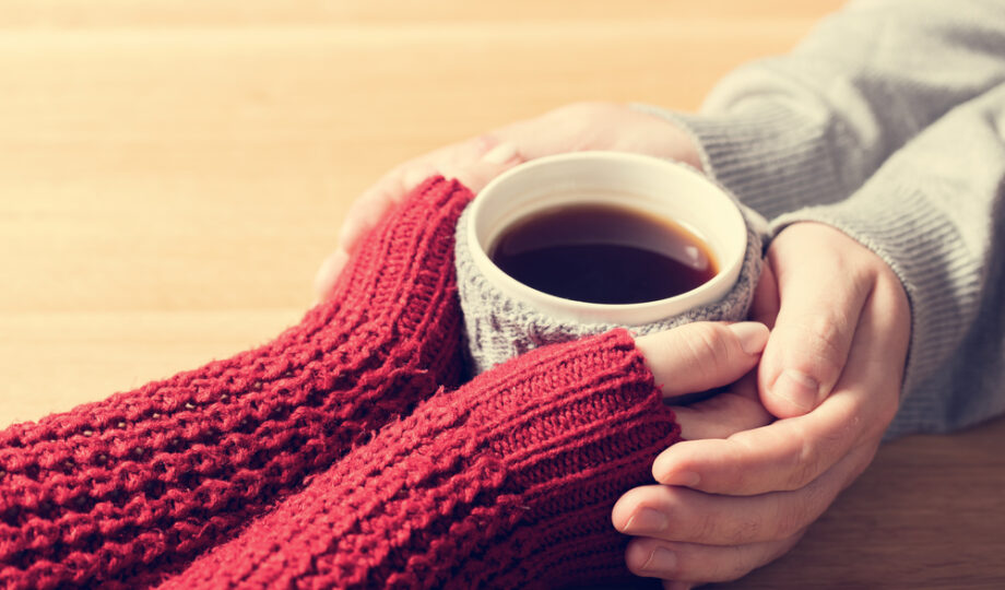 A,Couple,In,Love,Warming,Hands,With,A,Hot,Mug